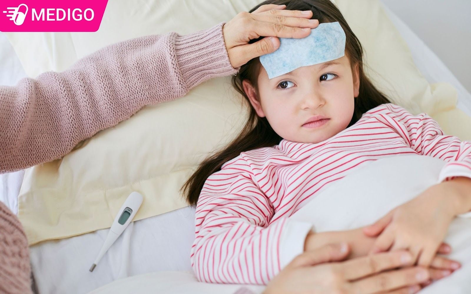 Tre-em-khi-do-nhiet-do-o-nach-tren-38-do-C-thi-duoc-coi-la-sot